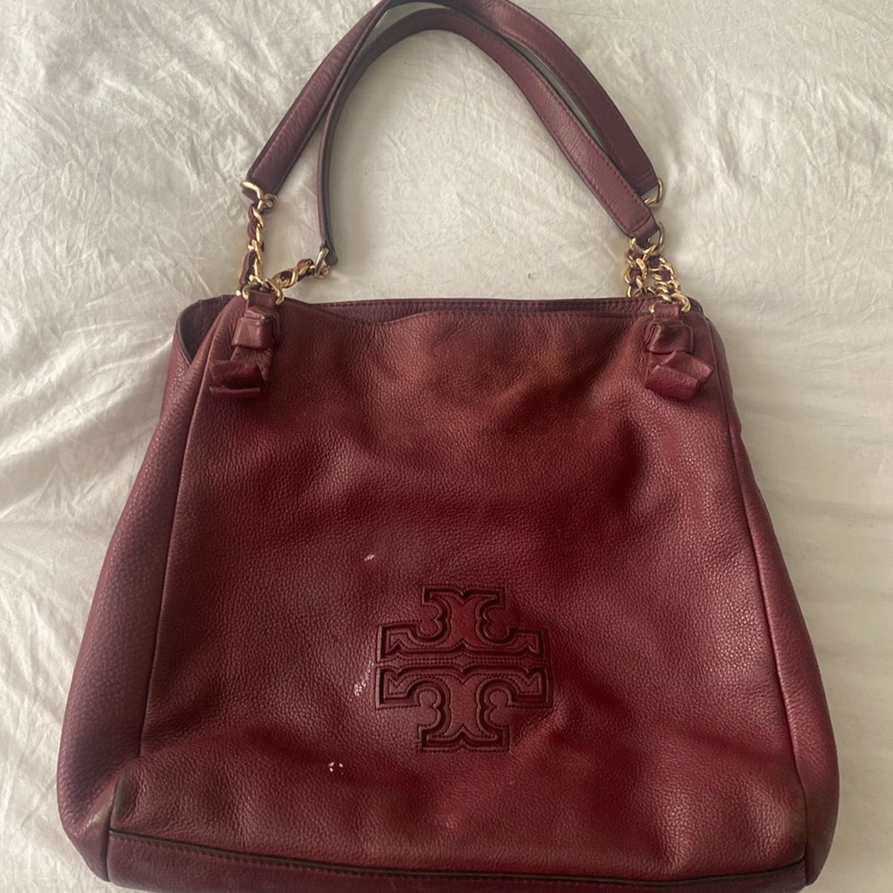 Tory and Burch bag.  3 white paint stains needs to be cared for